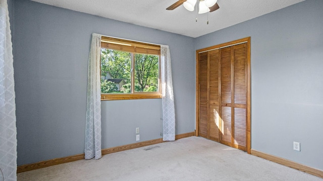 108 Viking Dr, Colfax, WI 54730 - unfurnished bedroom featuring a closet, carpet flooring, and ceiling fan