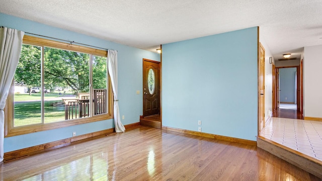 108 Viking Dr, Colfax, WI 54730 - unfurnished room featuring wood finished floors and a textured ceiling