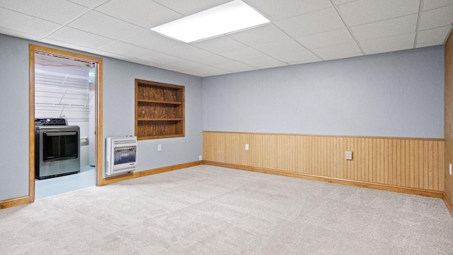 108 Viking Dr, Colfax, WI 54730 - carpeted spare room featuring heating unit, washer / dryer, wooden walls, wainscoting, and built in features