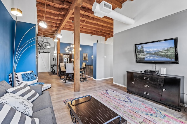 400 1st St Unit 611, Minneapolis, MN 55401 - living area with a wood ceiling with exposed beams, a towering ceiling, and wood finished floors