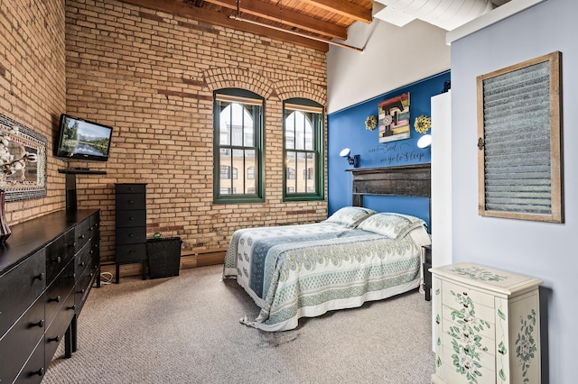 400 1st St Unit 611, Minneapolis, MN 55401 - bedroom with brick wall, a wood ceiling with exposed beams, and carpet floors