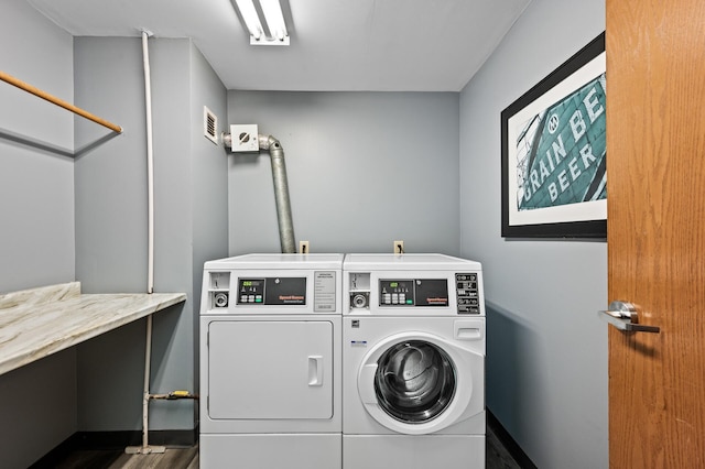 400 1st St Unit 611, Minneapolis, MN 55401 - community laundry featuring washing machine and clothes dryer and wood finished floors