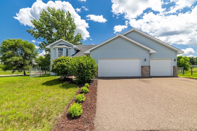 24155 Whispering Cir, East Bethel, MN 55005 - view of front of property with driveway, an attached garage, and brick siding