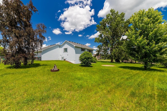 24155 Whispering Cir, East Bethel, MN 55005 - view of green lawn with a fire pit