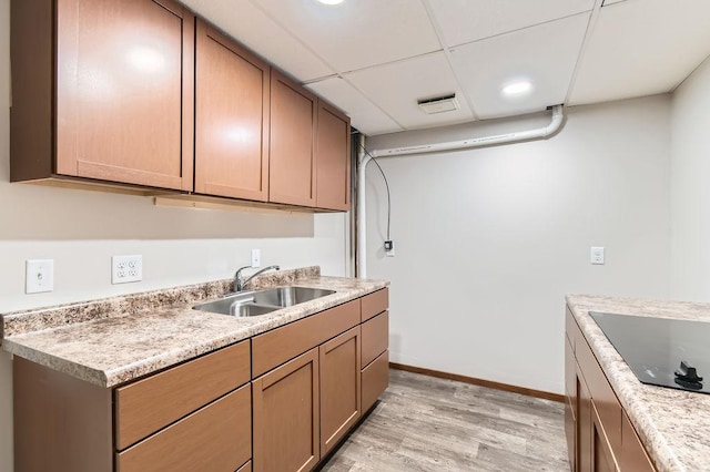14829 50th St N, Baytown Twp, MN 55082 - kitchen featuring light wood-style floors, black electric stovetop, light countertops, a drop ceiling, and recessed lighting