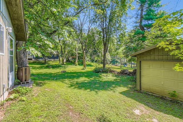 14829 50th St N, Baytown Twp, MN 55082 - view of green lawn featuring a garage and an outbuilding