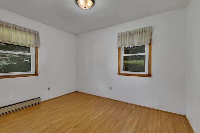 11965 State Highway 15, Kimball, MN 55353 - spare room with light wood-type flooring and a baseboard heating unit
