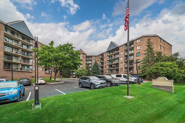 2601 Kenzie Ter Unit 519, Saint Anthony, MN 55418 - view of apartment building / complex featuring uncovered parking