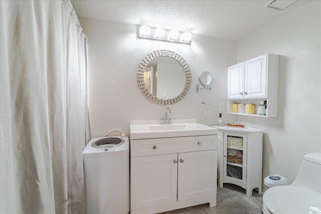 2601 Kenzie Ter Unit 519, Saint Anthony, MN 55418 - bathroom with a textured ceiling and vanity
