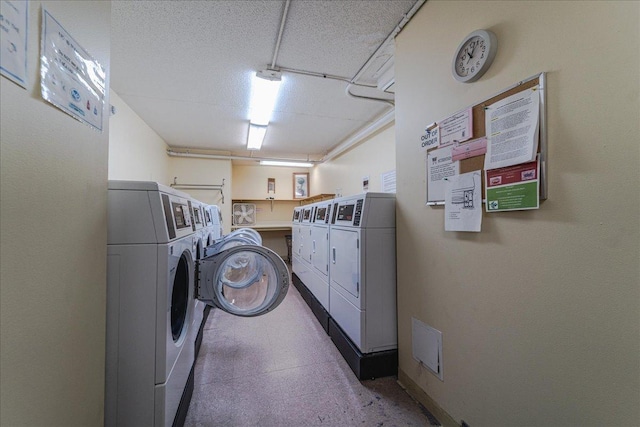 2601 Kenzie Ter Unit 519, Saint Anthony, MN 55418 - community laundry with washing machine and dryer and a textured ceiling