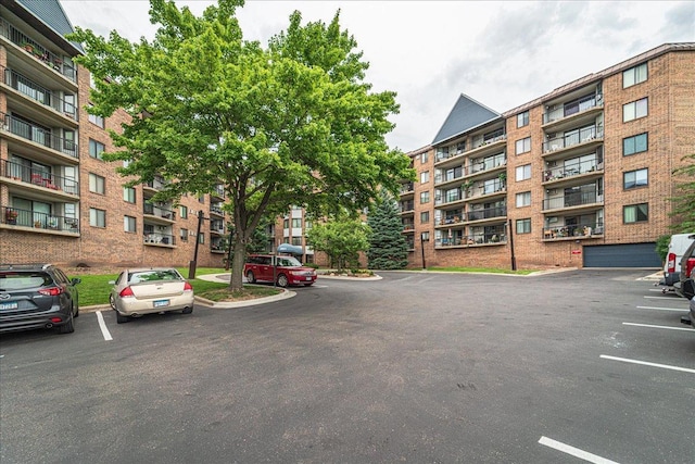 2601 Kenzie Ter Unit 519, Saint Anthony, MN 55418 - view of apartment building / complex featuring uncovered parking