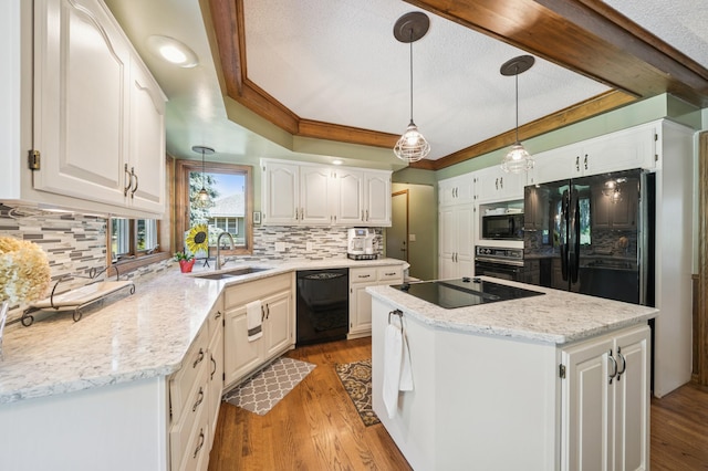 901 Grandview Dr, Hudson, WI 54016 - kitchen featuring black appliances, a kitchen island, tasteful backsplash, and white cabinets