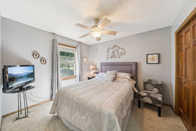 901 Grandview Dr, Hudson, WI 54016 - bedroom with light colored carpet, a textured ceiling, a ceiling fan, and a closet