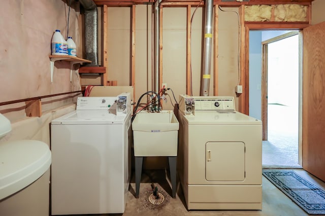 13752 Round Lake Blvd NW, Andover, MN 55304 - washroom featuring washing machine and clothes dryer and a sink