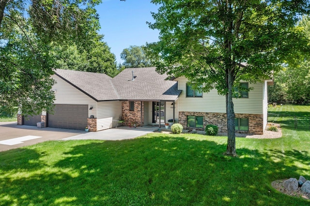 10200 Kadler Ave NE, Otsego, MN 55362 - tri-level home with brick siding, a front yard, a garage, and concrete driveway