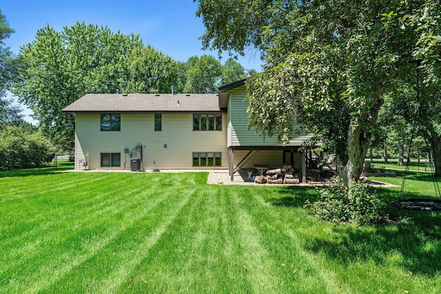 10200 Kadler Ave NE, Otsego, MN 55362 - rear view of house featuring a lawn
