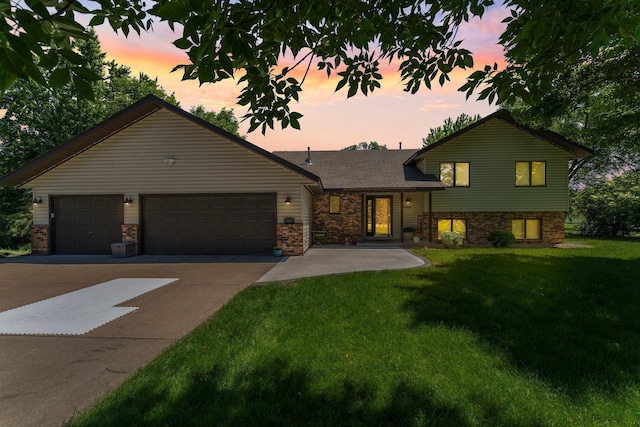 10200 Kadler Ave NE, Otsego, MN 55362 - split level home with concrete driveway, a yard, and a garage