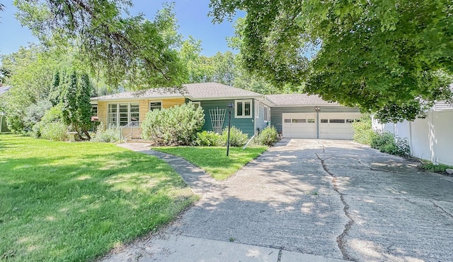 540 8th St, Bird Island, MN 55310 - ranch-style house with an attached garage, driveway, and a front lawn