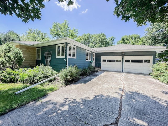 540 8th St, Bird Island, MN 55310 - ranch-style home with driveway and a garage