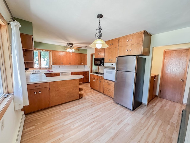 540 8th St, Bird Island, MN 55310 - kitchen featuring white appliances, open shelves, baseboard heating, and light wood-type flooring