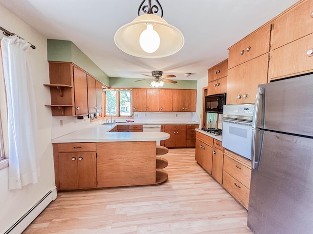 540 8th St, Bird Island, MN 55310 - kitchen featuring stainless steel appliances, a baseboard heating unit, open shelves, a peninsula, and light countertops