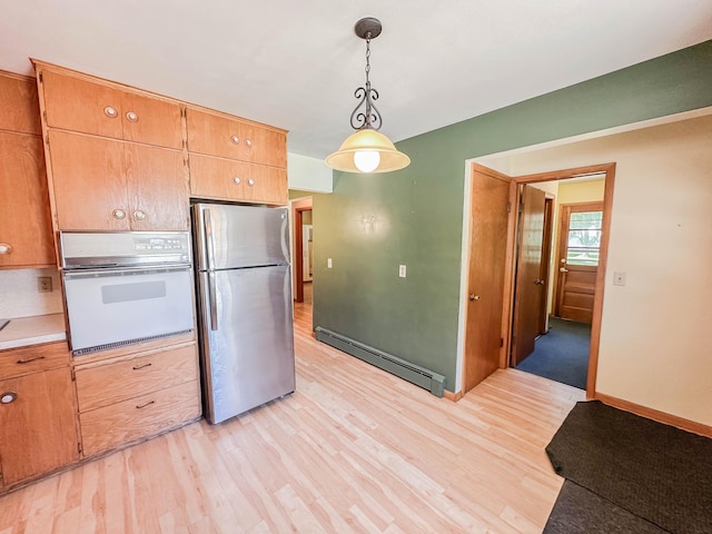 540 8th St, Bird Island, MN 55310 - kitchen with oven, freestanding refrigerator, baseboard heating, light wood finished floors, and pendant lighting