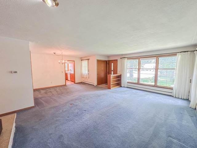 540 8th St, Bird Island, MN 55310 - spare room featuring a baseboard heating unit, light colored carpet, a chandelier, and a textured ceiling