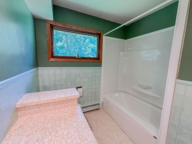 540 8th St, Bird Island, MN 55310 - full bath with tile walls, a baseboard heating unit, shower / bathtub combination, and a wainscoted wall