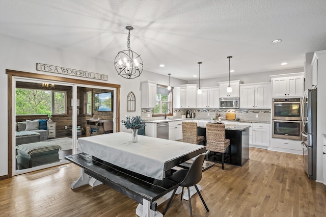 1799 158th Ln NW, Andover, MN 55304 - dining area featuring light wood-style floors, recessed lighting, and a chandelier