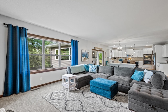 1799 158th Ln NW, Andover, MN 55304 - living room with light carpet, plenty of natural light, and a chandelier