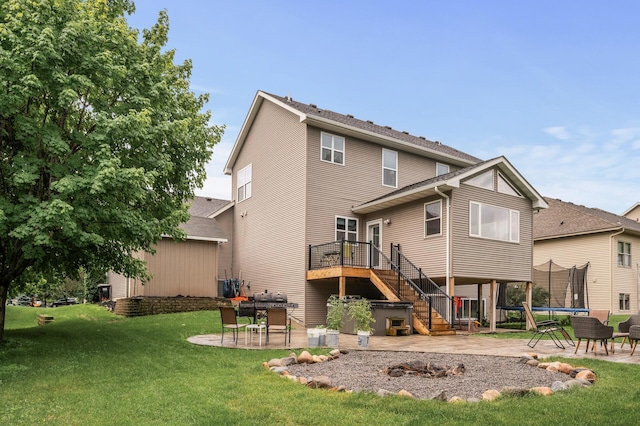 1799 158th Ln NW, Andover, MN 55304 - back of house with a patio, stairs, a trampoline, and a wooden deck