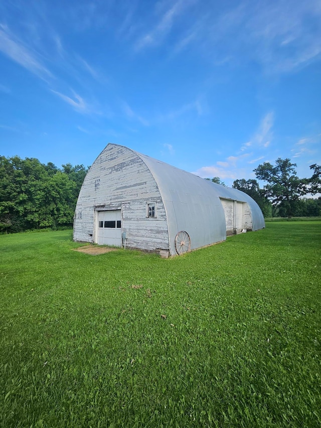 15596 464th St, Hewitt, MN 56453 - view of barn with a lawn