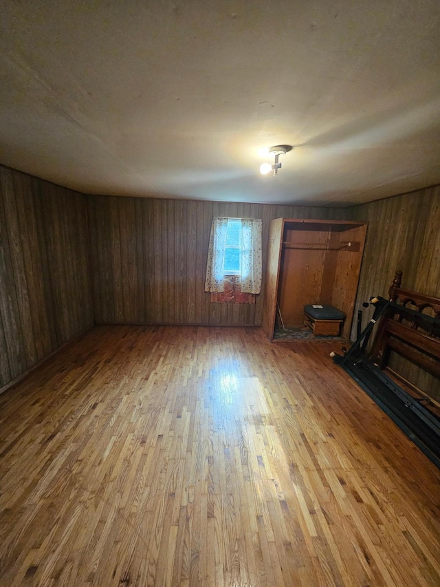 15596 464th St, Hewitt, MN 56453 - unfurnished living room with wood finished floors and wood walls
