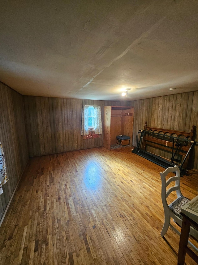 15596 464th St, Hewitt, MN 56453 - unfurnished room featuring hardwood / wood-style floors and wood walls