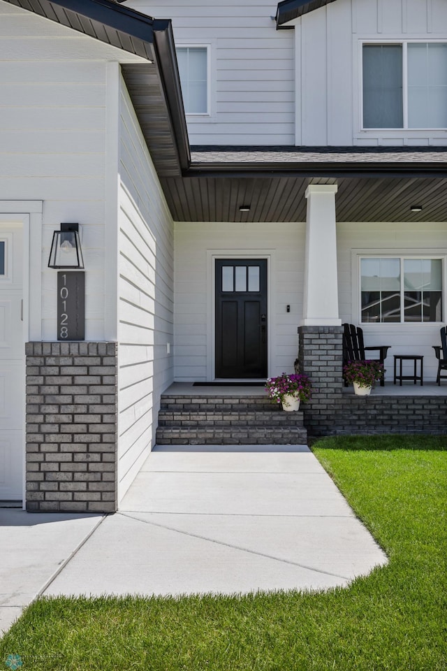 10128 Concord Dr, Horace, ND 58047 - property entrance featuring covered porch and a yard