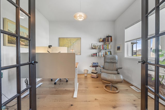 10128 Concord Dr, Horace, ND 58047 - office with french doors and wood finished floors