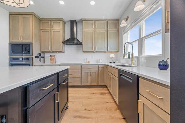 10128 Concord Dr, Horace, ND 58047 - kitchen featuring appliances with stainless steel finishes, wall chimney exhaust hood, light wood-style floors, backsplash, and light countertops