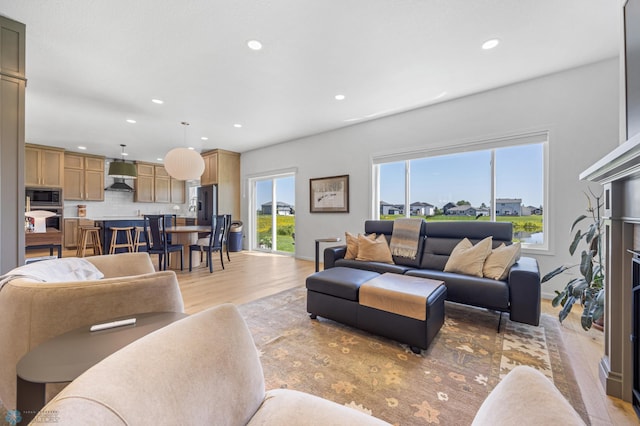 10128 Concord Dr, Horace, ND 58047 - living room with recessed lighting and light wood-style flooring