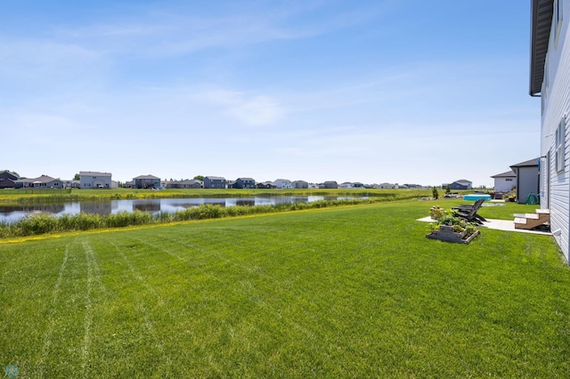 10128 Concord Dr, Horace, ND 58047 - view of green lawn featuring a water view