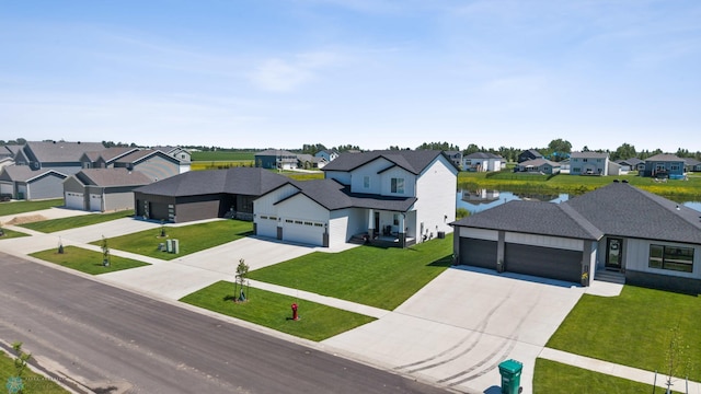 10128 Concord Dr, Horace, ND 58047 - view of front of property featuring a residential view, an attached garage, concrete driveway, and a front yard
