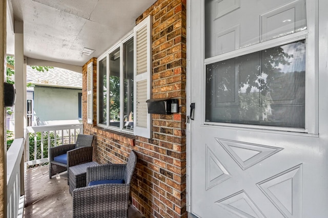 3850 Bryant Ave N, Minneapolis, MN 55412 - view of exterior entry with covered porch and brick siding