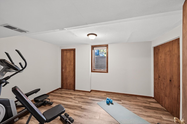 3850 Bryant Ave N, Minneapolis, MN 55412 - exercise area featuring wood finished floors and baseboards