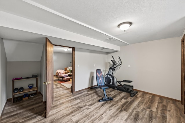 3850 Bryant Ave N, Minneapolis, MN 55412 - workout room featuring wood finished floors and a textured ceiling