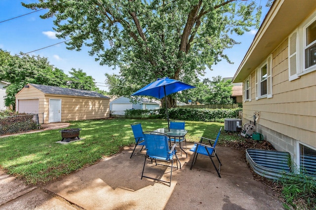 3850 Bryant Ave N, Minneapolis, MN 55412 - fenced backyard featuring an outdoor fire pit, outdoor dining area, a patio area, and an outbuilding