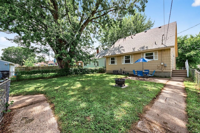 3850 Bryant Ave N, Minneapolis, MN 55412 - view of yard with an outdoor fire pit and a patio area