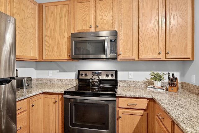 545 1st St Unit 400, Minneapolis, MN 55401 - kitchen featuring stainless steel appliances and light stone countertops
