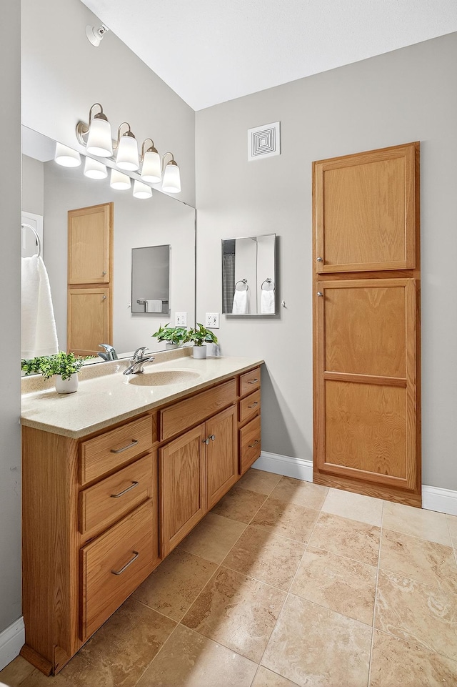 545 1st St Unit 400, Minneapolis, MN 55401 - bathroom featuring vanity and baseboards