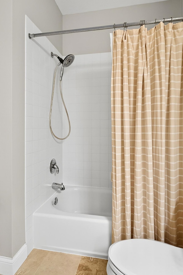 545 1st St Unit 400, Minneapolis, MN 55401 - bathroom featuring shower / bathtub combination with curtain and tile patterned floors