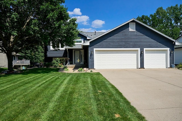 19161 Zane St NW, Elk River, MN 55330 - split level home with concrete driveway, an attached garage, and a front lawn