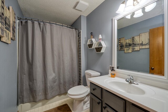 19161 Zane St NW, Elk River, MN 55330 - bathroom featuring a textured ceiling, vanity, and shower / bath combo with shower curtain